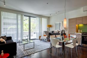 Berkeley apartment for rent - A modern kitchen with a glass table and chairs.