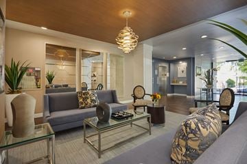 Los Angeles apartment for rent - a living room with couches and a glass coffee table