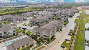 Grand Prairie apartment for rent - A suburban neighborhood with houses and a pool.