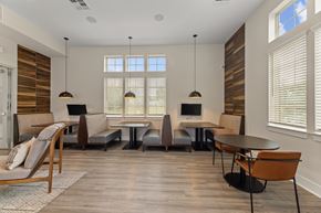 Grand Prairie apartment for rent - A modern dining room with a wooden table and chairs.