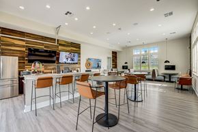 Grand Prairie apartment for rent - A modern kitchen with a dining table and chairs.