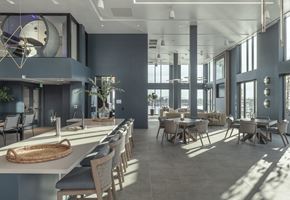 Oakland apartment for rent - a large dining room with tables and chairs and large windows