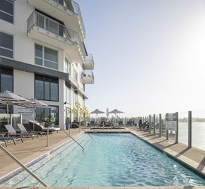 Oakland apartment for rent - a swimming pool in front of a hotel on the water