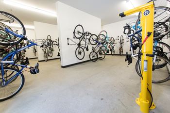 A room filled with lots of bikes on a wall