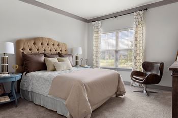 Master bedroom with tufted headboard and modern furnishings