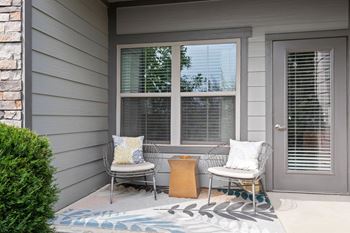 Covered patio with seating and decorative rug