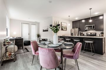 Indianapolis apartment for rent - a living room and kitchen with a table and chairs