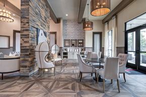 Overland Park apartment for rent - Elegant clubhouse lounge with wood accent wall at Adara Overland Park Apartments, Overland Park
