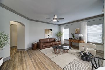 Overland Park apartment for rent - A living room with a brown couch and a coffee table.