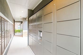 A long hallway with a row of lockers on the right.