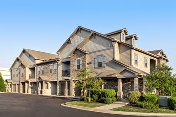 Exterior view of townhome style buildings with garages