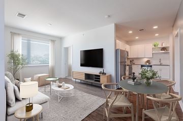 Indianapolis apartment for rent - A modern living room with a grey table and white chairs.