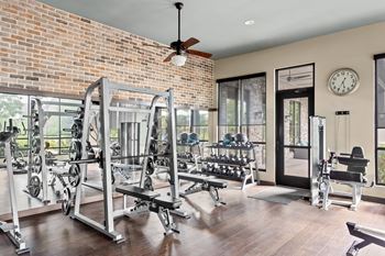 Fitness center with free weights and workout equipment