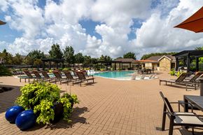 Katy apartment for rent - Pool area with a table and chairs at Grand Villas at Cinco Ranch, Texas, 77494