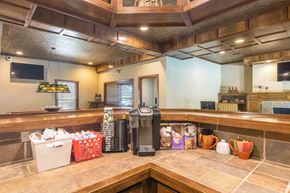 Lenexa apartment for rent - Community coffee bar with wooden cabinetry at London House Apartments, Lenexa, KS