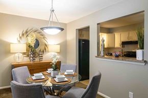 Lenexa apartment for rent - Dining area with kitchen pass through window at London House Apartments, Lenexa, KS 66215