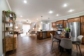 Shawnee apartment for rent - A modern kitchen with a dining table and chairs.