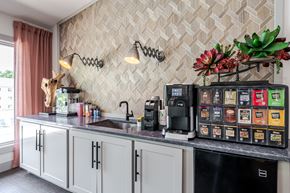 Springfield apartment for rent - A kitchen with a black fridge and a black counter top.