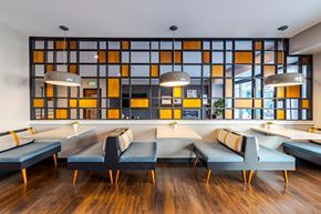 Minneapolis apartment for rent - A modern dining room with a long table and chairs.