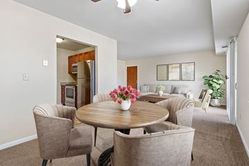 Hummelstown apartment for rent - a living room and dining room with a table and chairs