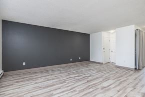 Kennewick apartment for rent - the living room and dining room of an apartment with wood flooring
