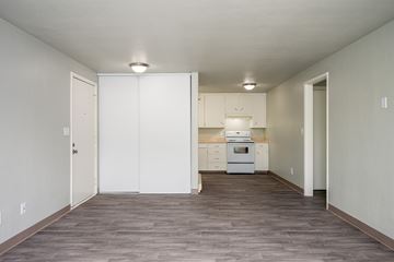 Corvallis apartment for rent - A kitchen with white cabinets and appliances is shown.