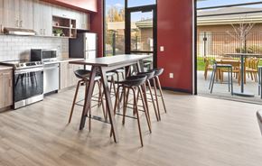 Spokane apartment for rent - a kitchen with a table and chairs in front of a window