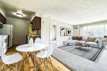 Spokane Valley apartment for rent - A modern living room with a dining table and chairs.