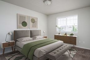 Vancouver apartment for rent - A bedroom with a large bed and two nightstands.