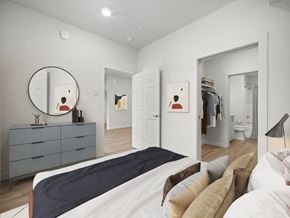 Spokane apartment for rent - a bedroom with a large bed and a mirror