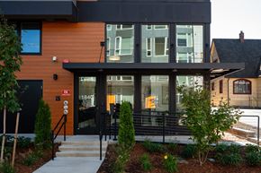 Eugene apartment for rent - the front of a building with glass doors and a staircase