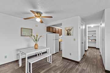 Kennewick apartment for rent - a living room with a table and a ceiling fan
