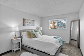 Kennewick apartment for rent - a bedroom with a bed and a mirror