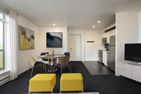 Eugene apartment for rent - A modern kitchen with a dining table and chairs.