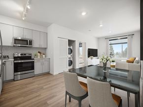 Spokane apartment for rent - a kitchen and living room with a table and chairs