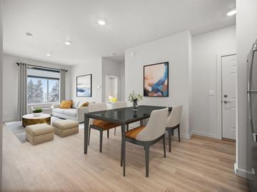 Spokane apartment for rent - a living room and dining room with a table and chairs
