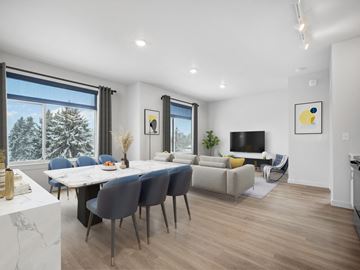 Spokane apartment for rent - a living room and dining room with a table and chairs