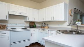 Wilsonville apartment for rent - Village at Main Street | Spacious Kitchen with White Cabinetry and White Appliances