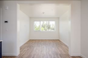 Bend apartment for rent - A room with a window and wooden flooring.