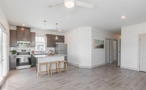 Boardman townhouse for rent - A modern kitchen with a dining table and chairs.