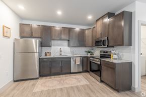 Boardman townhouse for rent - a kitchen with stainless steel appliances and wooden cabinets