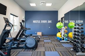 Oregon City townhouse for rent - a gym with cardio equipment and weights