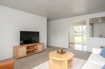 Springfield apartment for rent - A living room with a television and a coffee table.