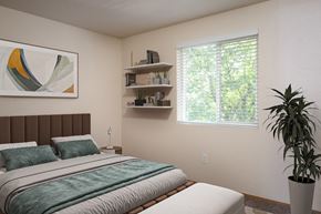 Albany apartment for rent - A bedroom with a large bed and a potted plant.