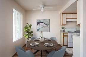 Albany apartment for rent - A dining room with a table set for two and a painting on the wall.