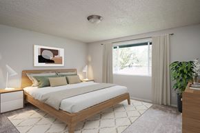 Salem apartment for rent - A bedroom with a large bed and a painting on the wall.