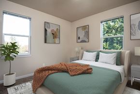 Salem apartment for rent - a bedroom with a bed and two windows