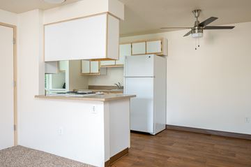 Portland apartment for rent - A kitchen with white cabinets and a white refrigerator.