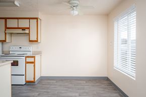 Albany apartment for rent - A kitchen with a white oven and wooden cabinets.