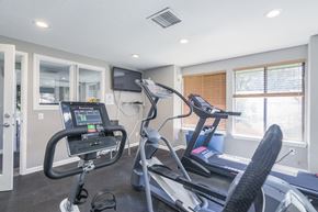 Salem apartment for rent - the gym has cardio equipment and a flat screen tv
